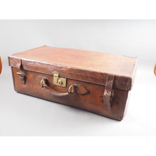 231 - A 1930s leather travel trunk, 28