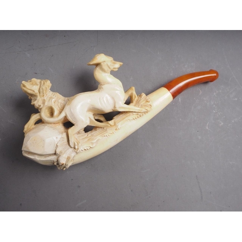 232 - A 19th century meerschaum pipe, carved with dogs, 4 3/4