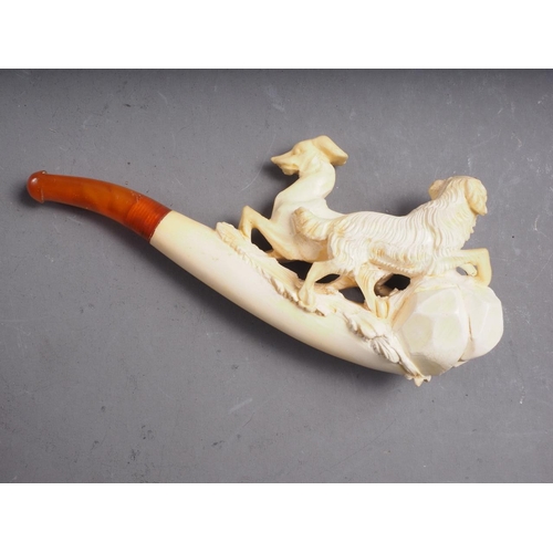 232 - A 19th century meerschaum pipe, carved with dogs, 4 3/4