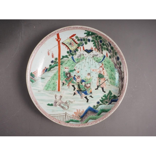 96 - A Chinese famille verte dish with warrior decoration, 12 3/4