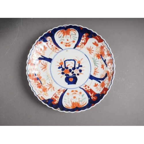 96 - A Chinese famille verte dish with warrior decoration, 12 3/4