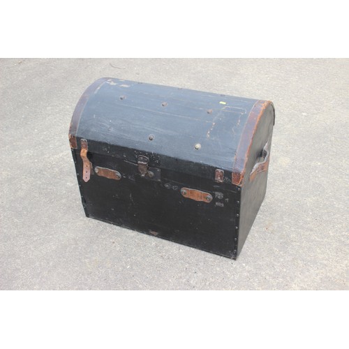 657 - A black leather bound dome topped trunk with leather carrying straps and floral patterned interior, ... 