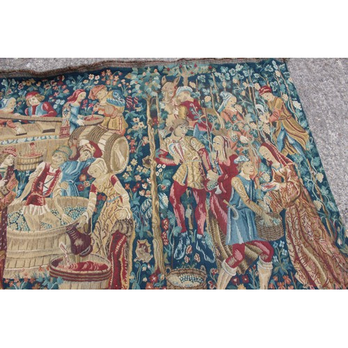 158 - A Jacquard woven tapestry with figures in a landscape design, 73 1/2