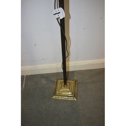 254 - A brass standard lamp with fluted column, on stepped and embossed square base, 52 1/2