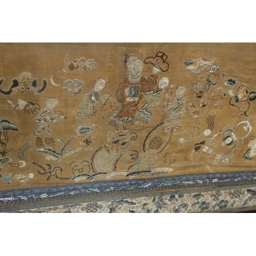 107 - A Chinese silk embroidered triple panel with figures on a yellow ground and blue butterfly and flowe... 