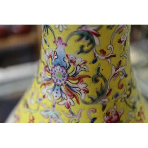 91 - A Chinese famille rose baluster vase with flower, tree and rock decoration, and seal mark to base, 1... 