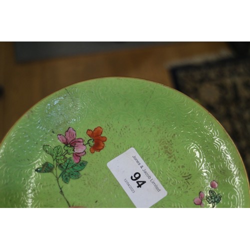 94 - A Chinese bowl with floral scrolled decoration on a pink enamelled ground and seal mark to base, 5 3... 