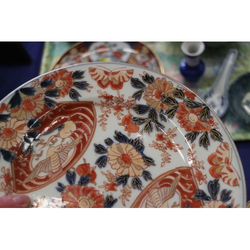 102 - A Chinese shaped Imari plate with mythical beast decoration, 8 1/4