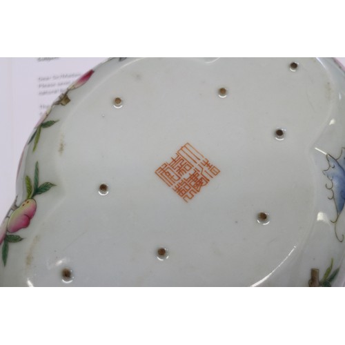 98 - A Chinese famille rose shaped dish with bat, peach and character decoration, and seal mark to base, ... 