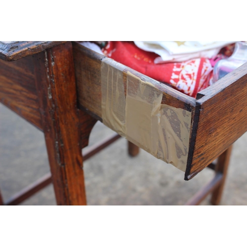 466 - An antique oak elm and walnut side table, fitted one drawer, on chamfered and stretchered supports, ... 