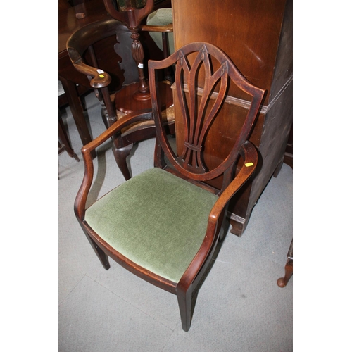 486 - An early 19th century carved mahogany elbow chair of Sheraton design with Gothic pierced splat back ... 