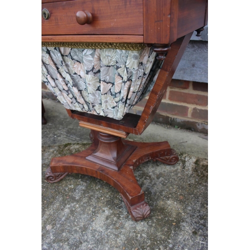 492 - A 19th century mahogany work table, fitted two drawers and well, on shaped support and quatreform ba... 