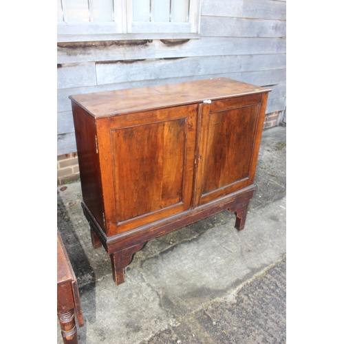 461 - A 19th century fruitwood cupboard enclosed two doors, on later stand, 41