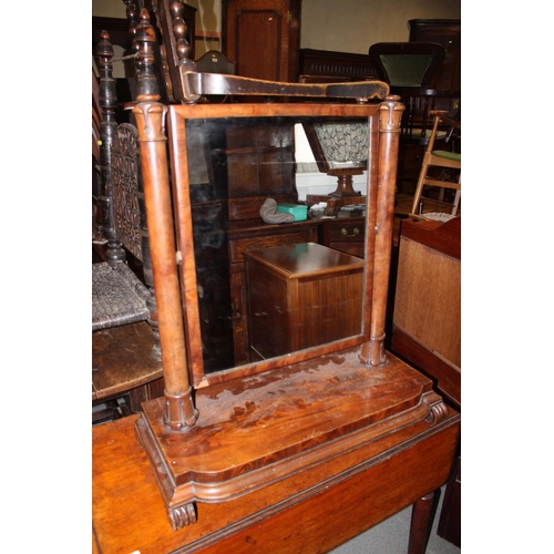 521 - A Victorian figured mahogany toilet mirror, on break bowfront plateau base, on scroll supports, 26 1... 