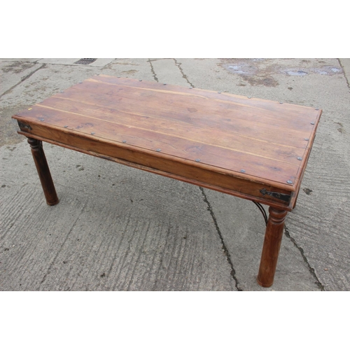 546 - A sheesham dining table, on turned supports, 71