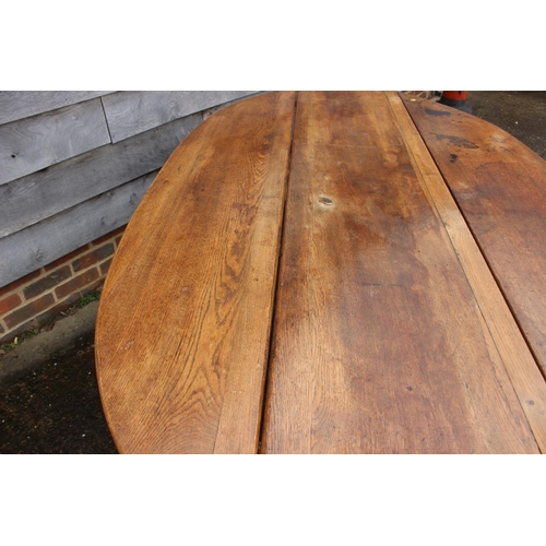 579 - An oak wake table of 17th century design with double gate and moulded supports, 84