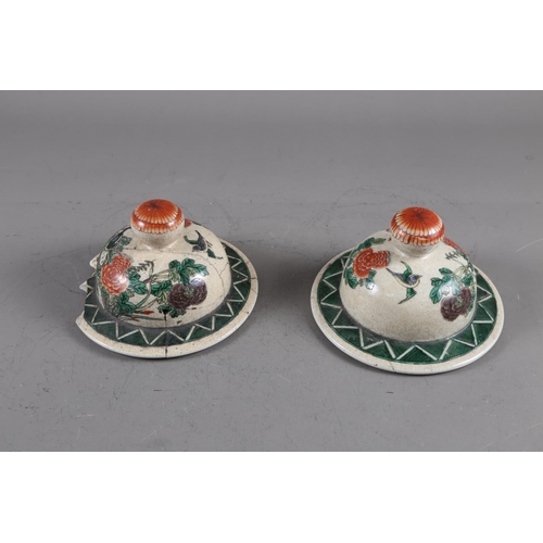 108 - A pair of Chinese famille verte crackle glazed baluster jars and covers with birds in a landscape de... 