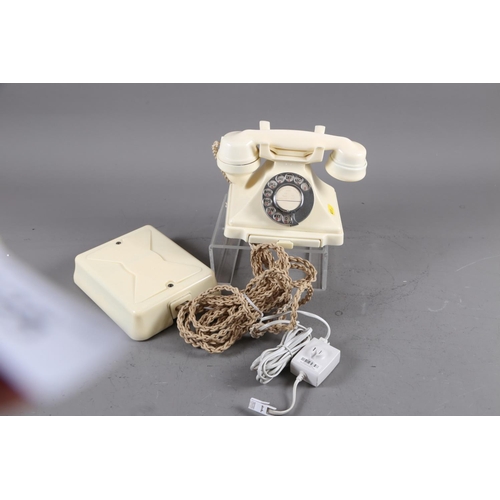 125 - A 200 series cream Bakelite telephone with wall 