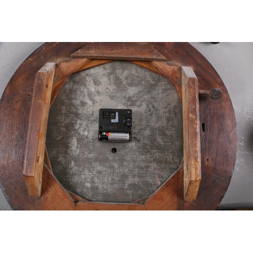 129 - An mahogany cased drop dial wall clock with later added quartz movement, 24 1/2