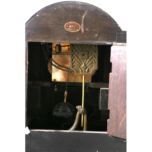 137 - An oak cased arch top mantel clock with barley twist columns, silvered dial and Arabic numerals, 12 ... 