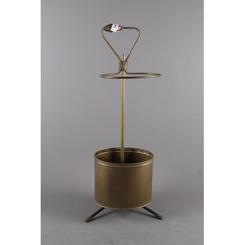 147 - A Mathieu Mategot brass umbrella stand, 27