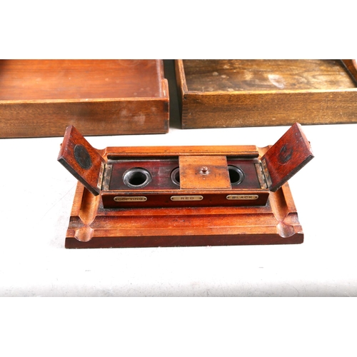 159 - Two wooden desk filing trays and a wooden inkstand, fitted three inkwells