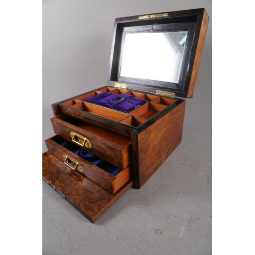 160 - A 19th century figured walnut brass inlaid jewellery box, the fitted interior with mirror, faux fron... 