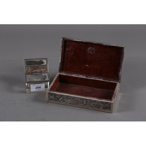 266 - An Oriental embossed white metal and burr wood cigarette box, and a vestas box with painted cover