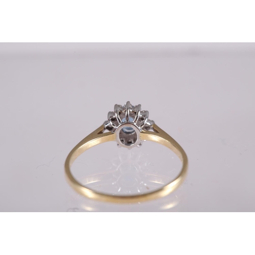 282 - An 18ct gold, diamond and aquamarine cluster ring, size O/P, 2.2g