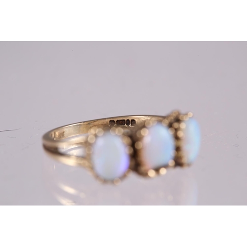 303 - A 9ct gold opal three-stone ring, size M/N, 3.1g (chip to central stone)