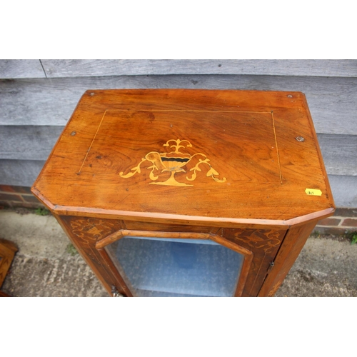 438 - A late 19th century figured walnut and inlaid music cabinet enclosed glazed door, on block base, 20