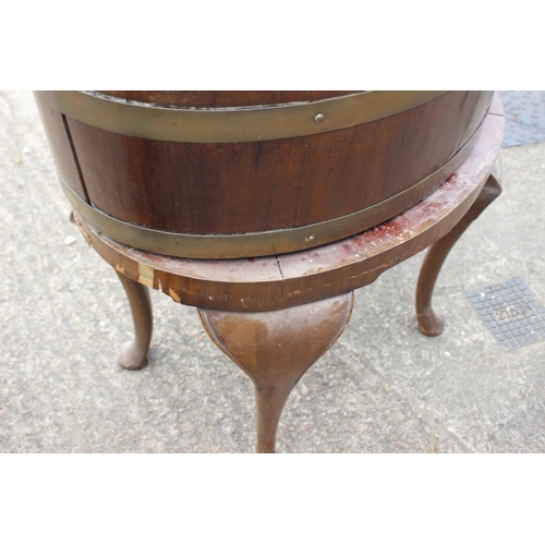 442 - A 19th century mahogany and brass bound oval planter with zinc lining, on turned supports and pad fe... 