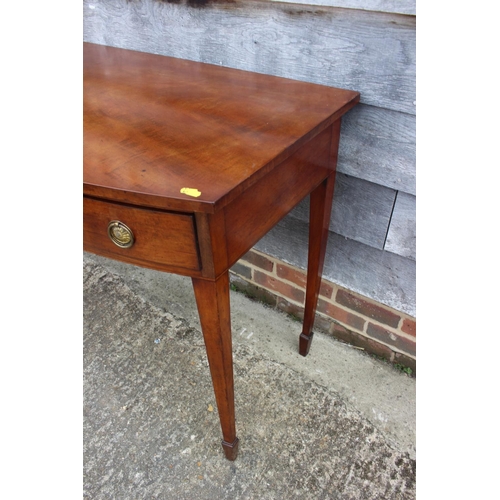 446 - A 19th century mahogany bowfront carving table, fitted three drawers with ring handles, on square ta... 