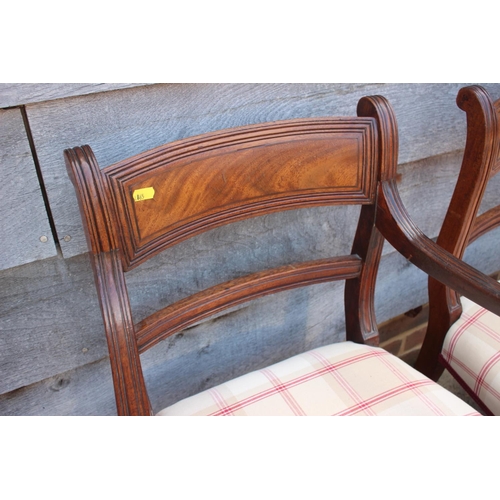 447 - A set of eight early 19th century bar back dining chairs with stuffed over seats, on turned supports... 