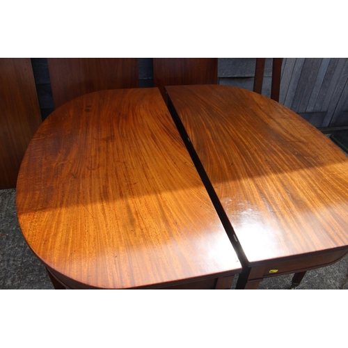 448 - A late 19th century mahogany dining table with three extra leaves, on square taper supports and bras... 