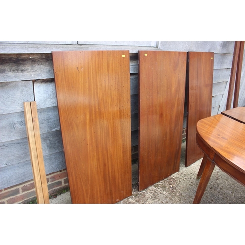 448 - A late 19th century mahogany dining table with three extra leaves, on square taper supports and bras... 