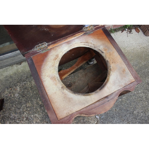 452 - A mahogany shape top commode stool, on cabriole supports, 19