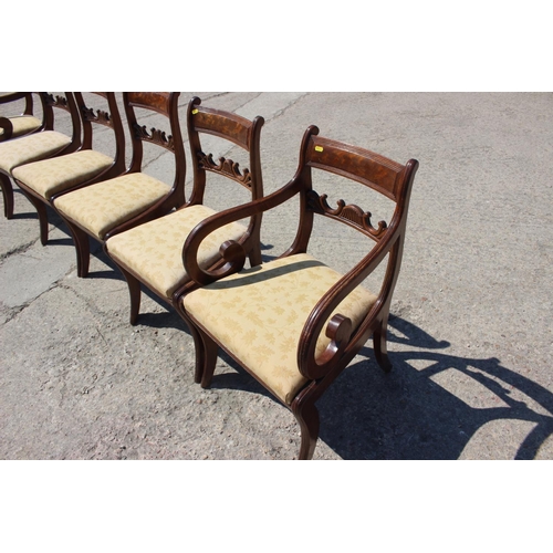 454 - A set of six William IV figured mahogany carved bar back dining chairs with drop-in seats, on sabre ... 