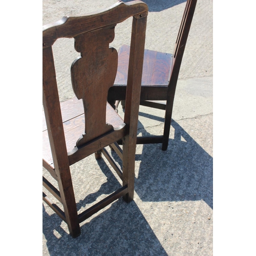 455 - Two 18th century oak panel seat side chairs with vase splat backs, on turned and stretchered support... 