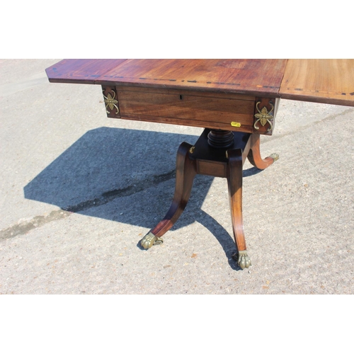 456 - A Regency mahogany and zebrano banded sofa table, fitted one drawer, on square column and quadruple ... 