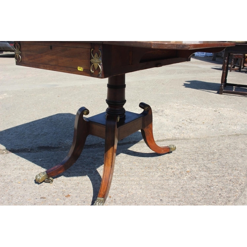 456 - A Regency mahogany and zebrano banded sofa table, fitted one drawer, on square column and quadruple ... 