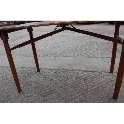 460 - A late 19th century maple folding table with 1-yard marking, on turned supports, 43