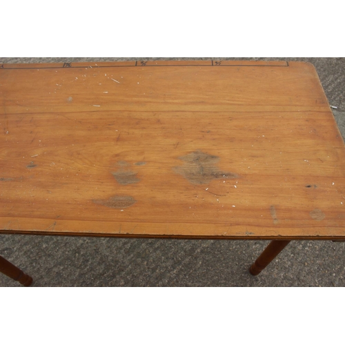 460 - A late 19th century maple folding table with 1-yard marking, on turned supports, 43