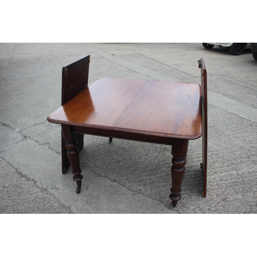 470 - A late 19th century mahogany extending dining table with two extra leaves, on turned supports, 74