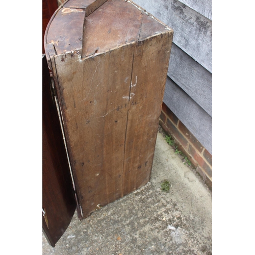 479 - An 18th century quarter-cut oak bowfront corner hanging cupboard, 23