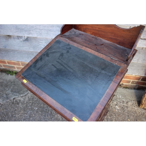 503 - A late 19th century walnut Davenport type desk, with raised back over writing slope, pull-out pen dr... 