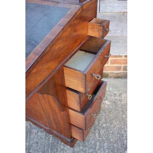 503 - A late 19th century walnut Davenport type desk, with raised back over writing slope, pull-out pen dr... 