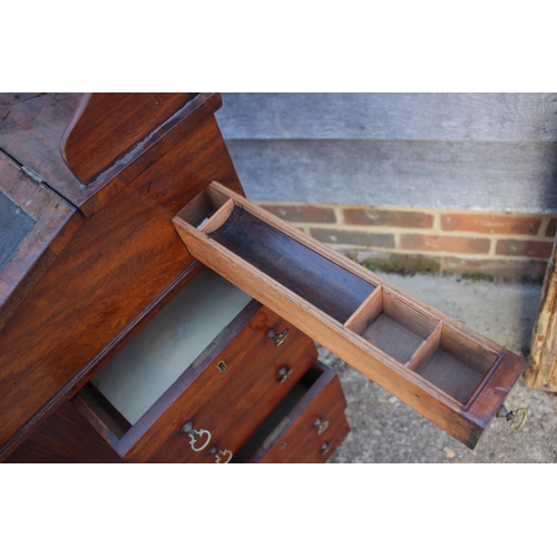 503 - A late 19th century walnut Davenport type desk, with raised back over writing slope, pull-out pen dr... 