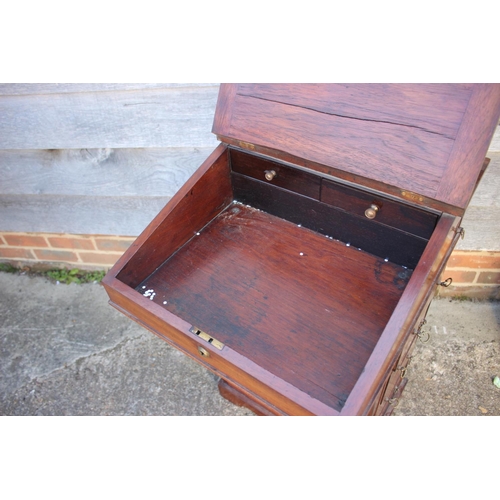 503 - A late 19th century walnut Davenport type desk, with raised back over writing slope, pull-out pen dr... 