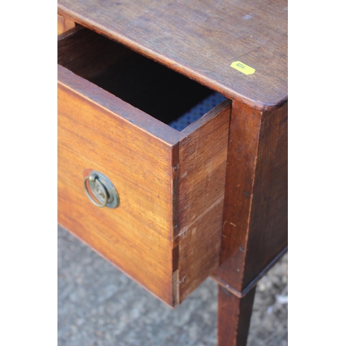 504 - A 19th century mahogany lowboy, fitted two deep and one shallow drawer, on square taper castored sup... 